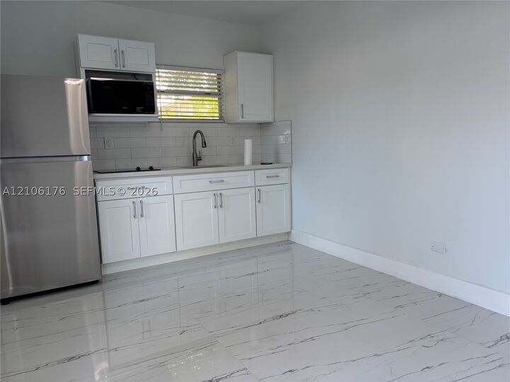 Property Photo: 214 NW 46th Ave 214 FL 33126