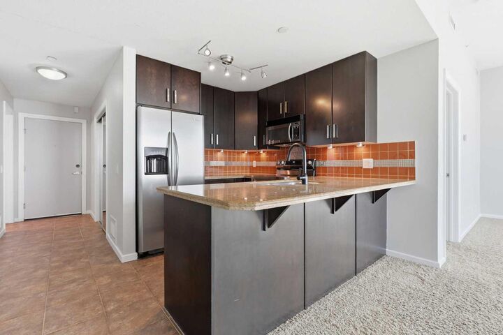 Property Photo:  1410 1 Street SE 1505  AB T2G 5T7 