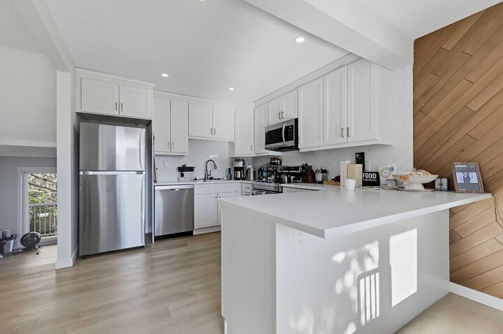 Property Photo: 302 Woodvale Crescent SW AB T2W 3P3