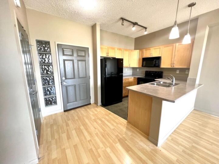 Property Photo: 12330 102 St 215 AB T8V 0N4