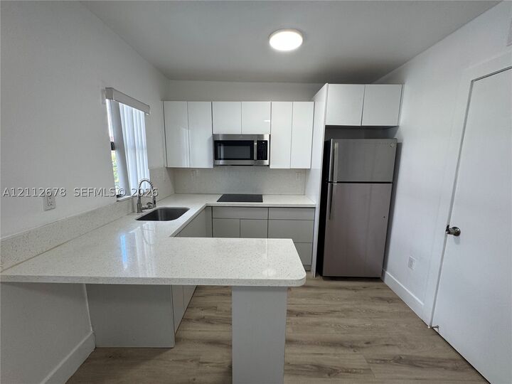 Property Photo: 1969 NW 2nd Ct 13 FL 33136