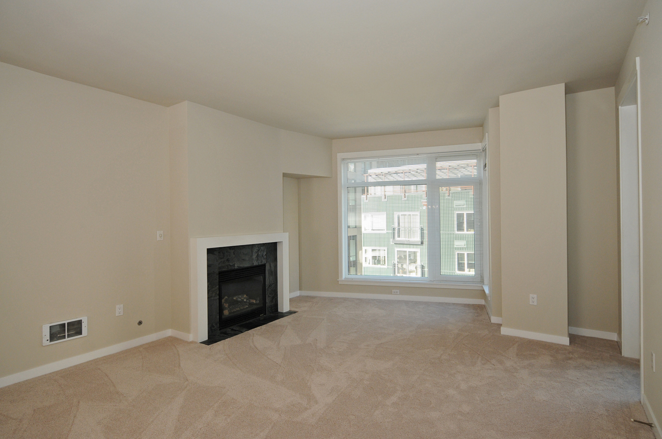 Property Photo: Living & dining room 2607 Western Ave 409 WA 98121